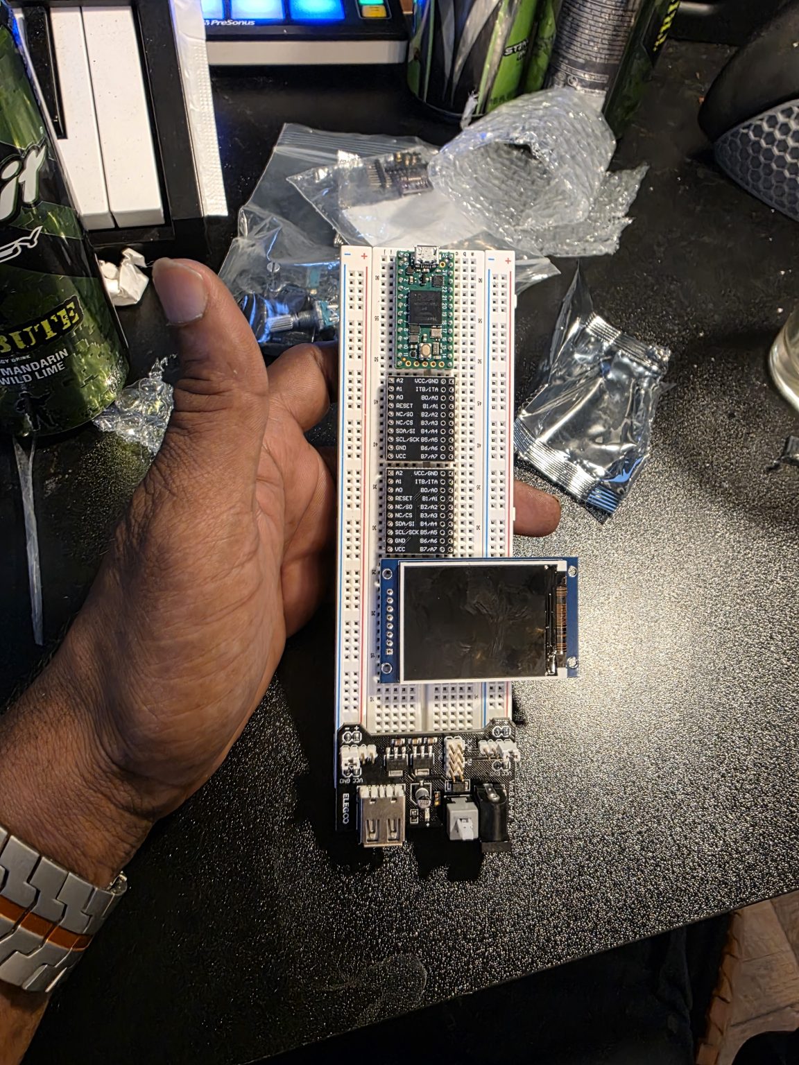 A breadboard loaded with components during an attempt to fit all of them onto one board.