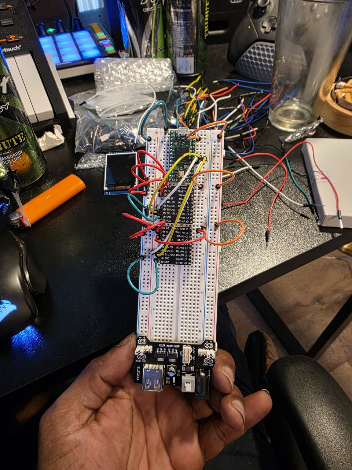 Wiring lifted off a breadboard and left floating, with the display disconnected.