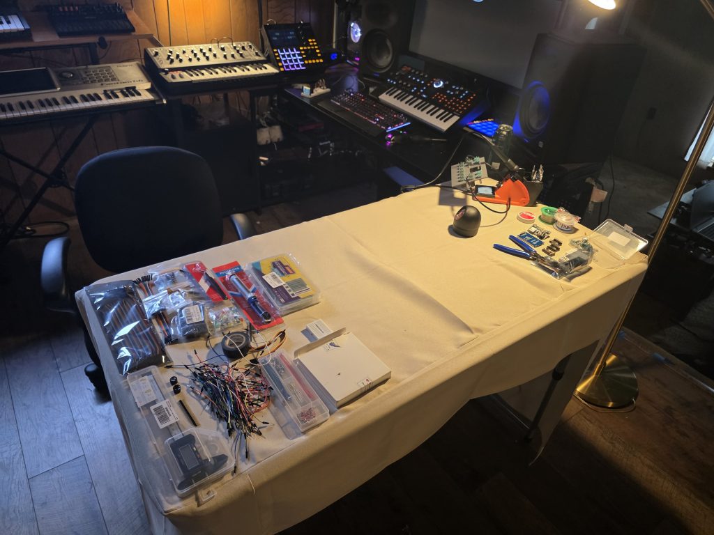 A makeshift soldering setup on a dining table.